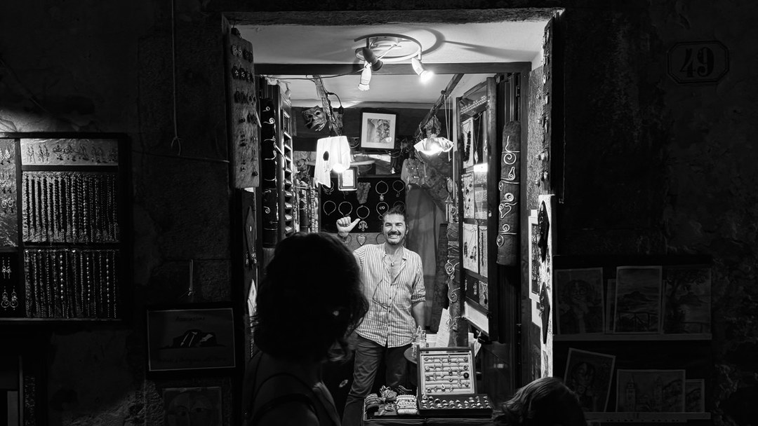 A lit shop doorway at night, from the archive